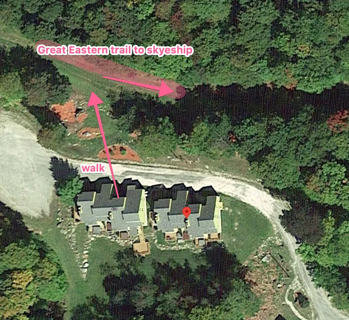 A vivid exterior shot capturing the Great Eastern trail, the skyship, walk path, surrounding forest, and an overall property layout. The scene is alive with green foliage and open skies, emphasizing summer activities like hiking, biking, and family gatherings in the lush mountain environment.